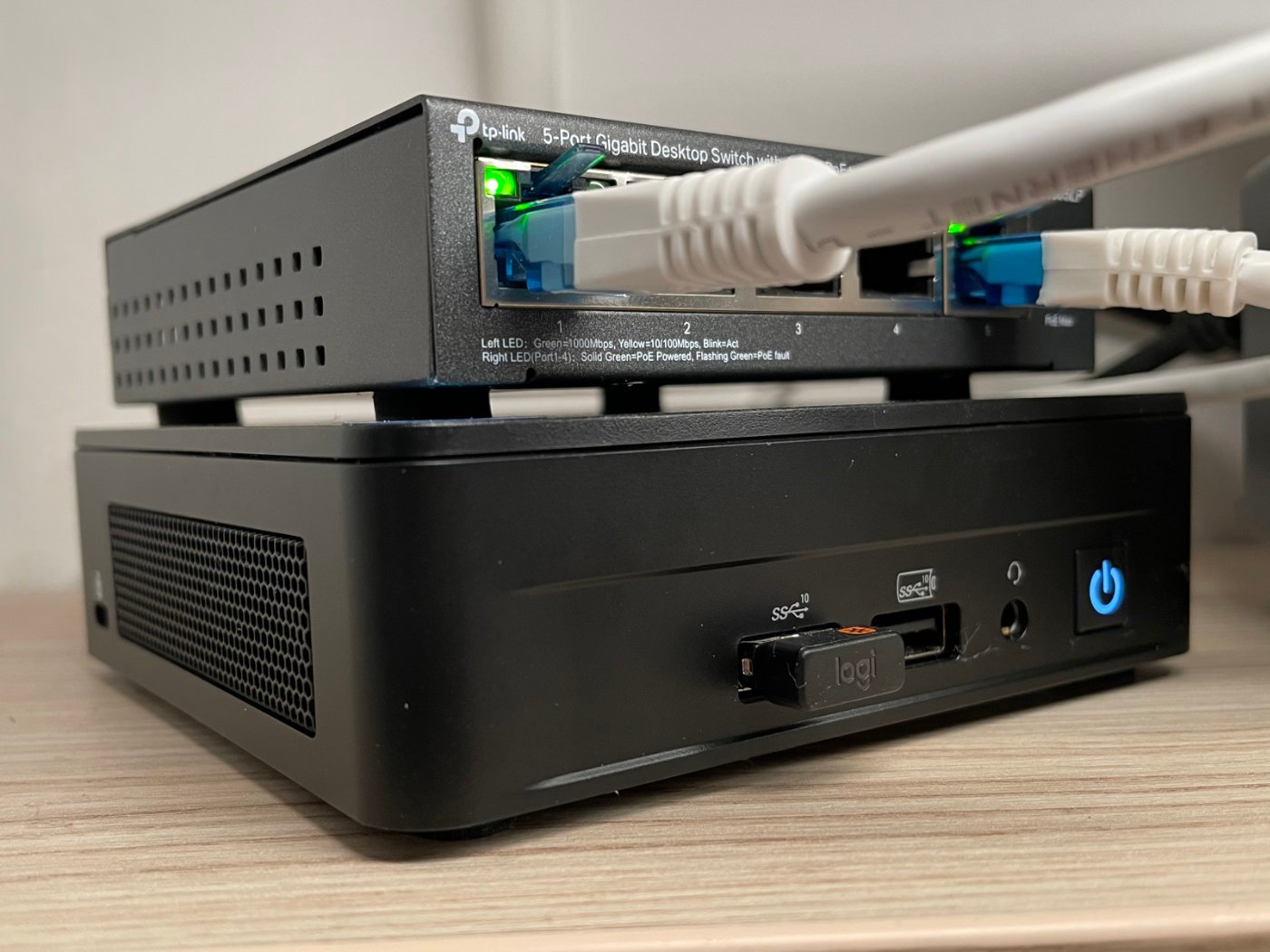 A shot showing the NUC (bottom) and a PoE switch (top).