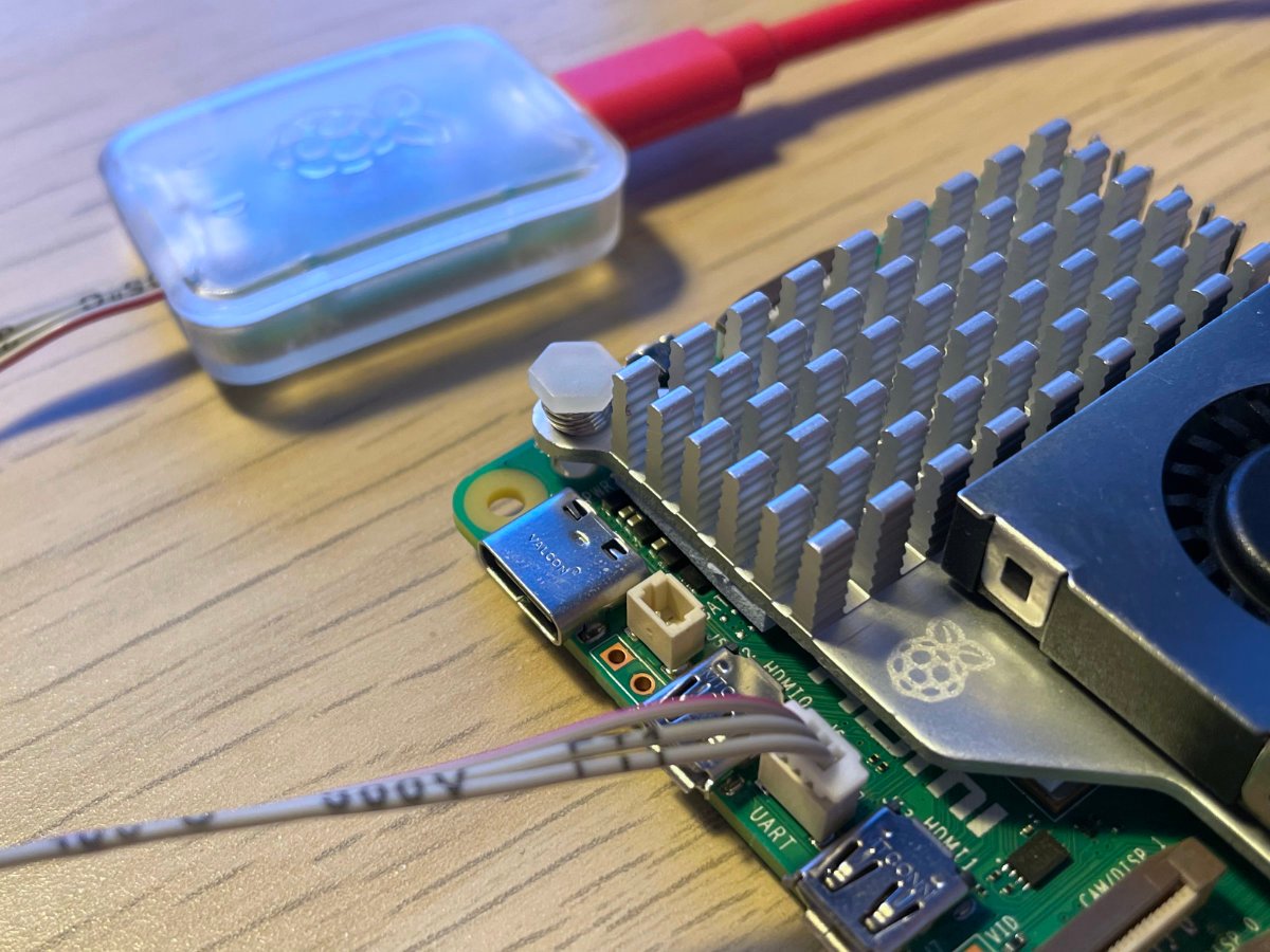 A shot showing the Raspberry Pi Debug Probe connected to the board.