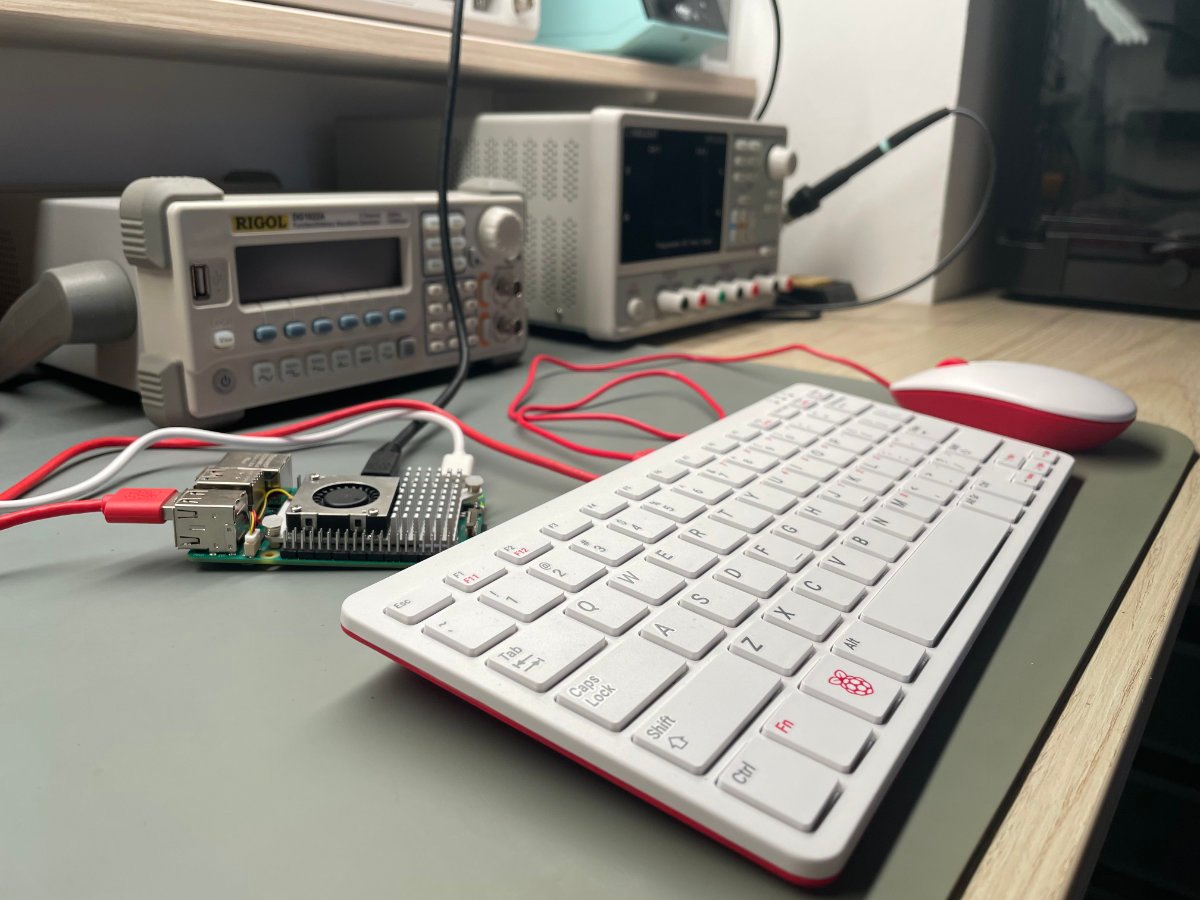 A photo showing the Raspberry Pi 5 board with its official accessories connected to it.