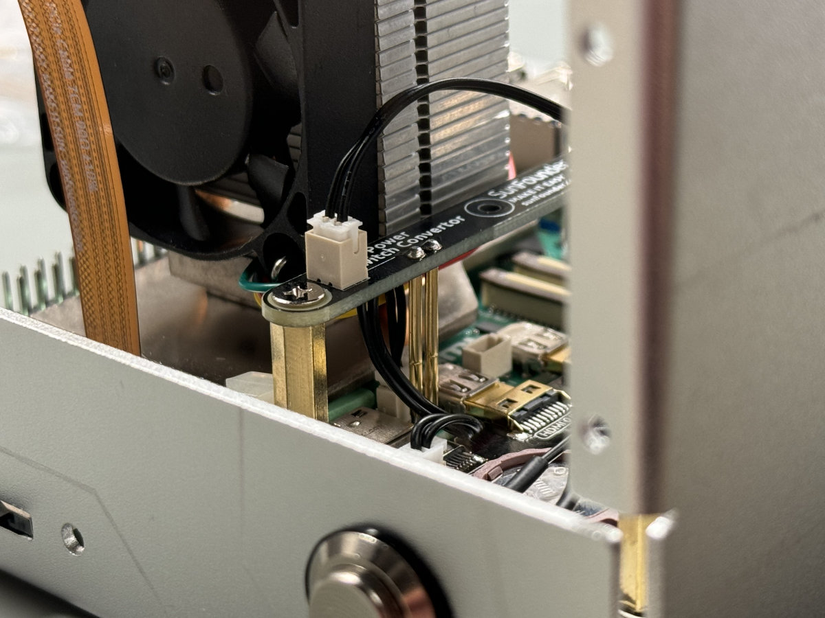 An alternate shot of the power button adapter board, showing it mounted in place inside the Pironman 5 case.