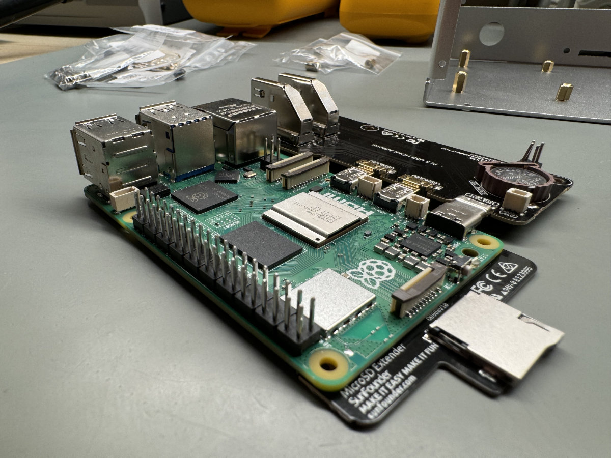 A photo showing the Raspberry Pi 5, along with two of the Pironman 5’s extension boards.