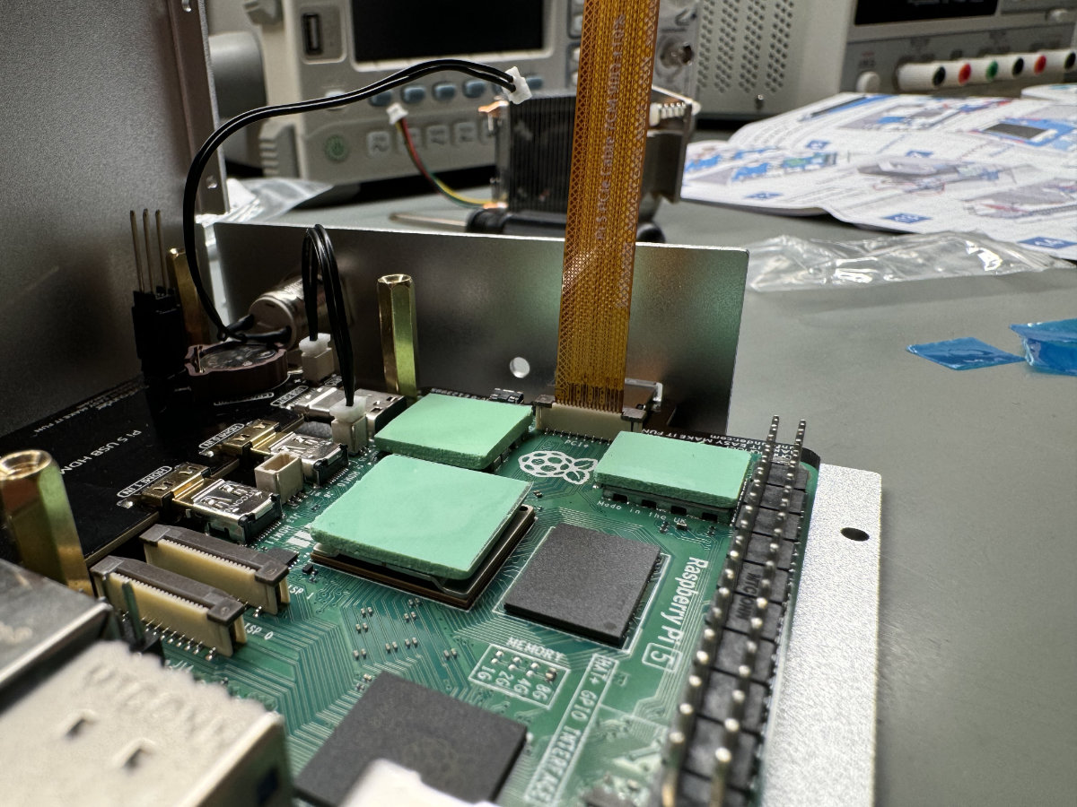 A close-up photo showing the Pironman 5’s thermal pads being mounted on the Raspberry Pi.