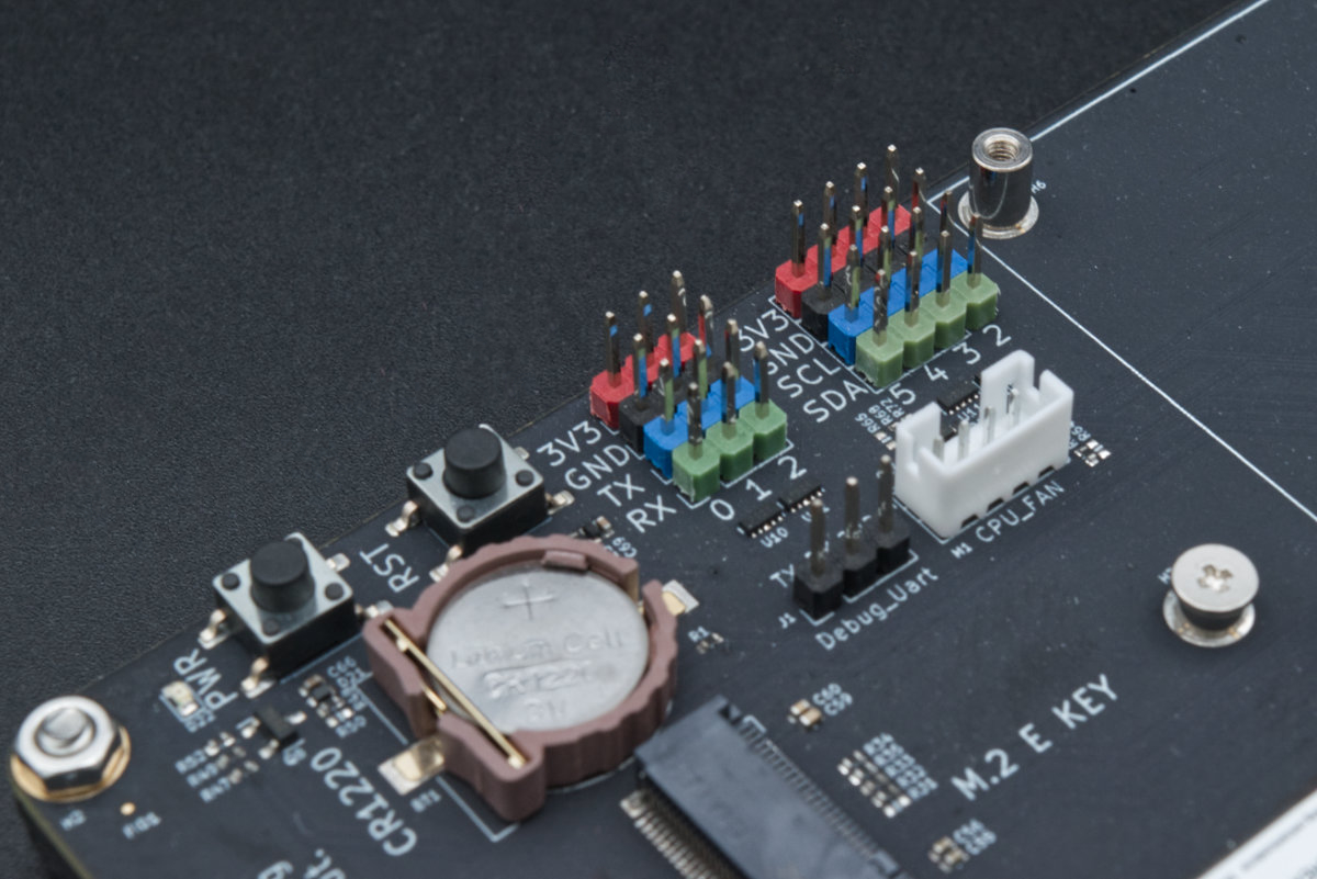 A very close up image showing several interfaces on the Lite carrier, including the RTC battery connector and I2C and UART interfaces.