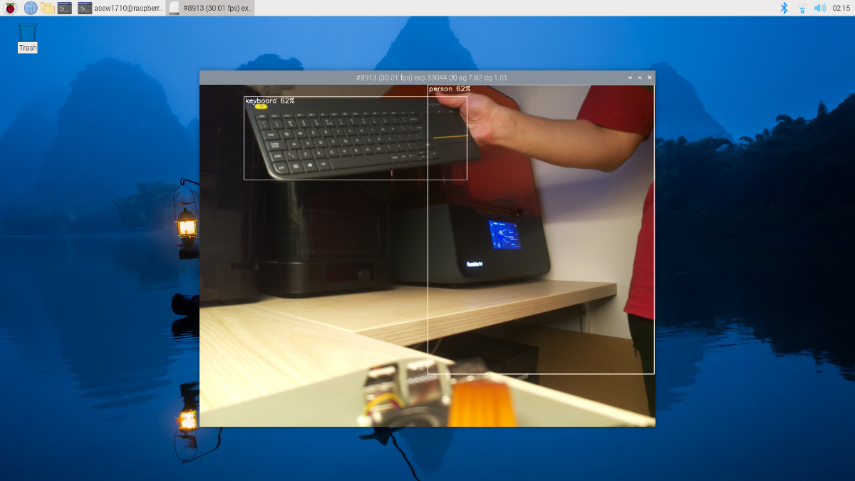 A screenshot showcasing a MobileNet SSD-based object recognition model running and recognizing a person holding a keyboard.