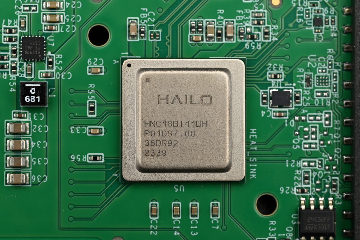 A close-up of the Hailo-8 chip, with the machining grooves visible on the writing.