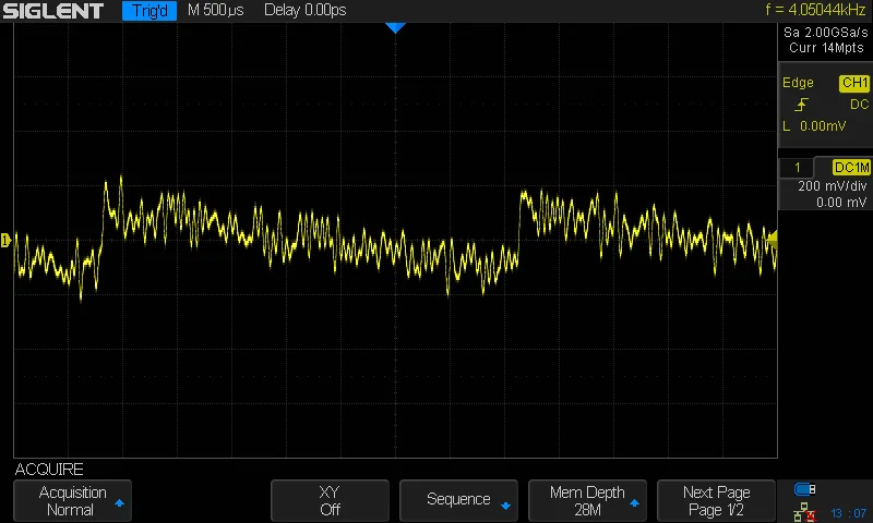 An oscilloscope screenshot showing a sawtooth wave with noise mixed in.