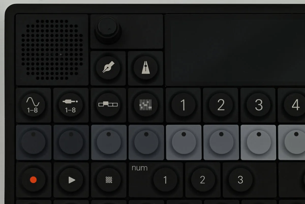 A close-up shot of the OP-XY with the four mode keys on the left, and four module keys on the right, just below the screen.