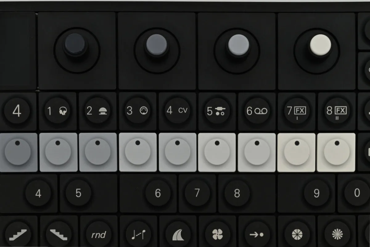 Another close-up of the OP-XY, with the four rotary encoders on the top and a row of track keys labelled 1-8 right below.