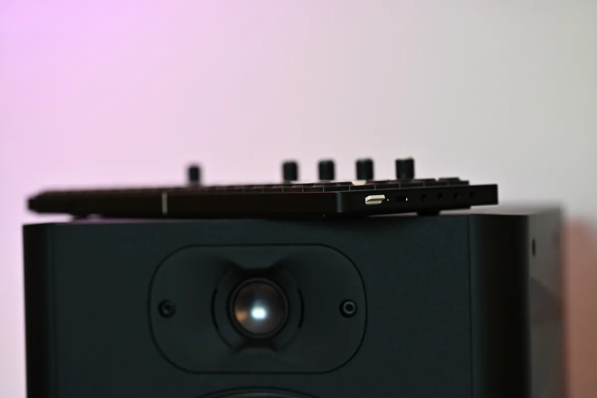 A photo of the OP-XY atop a Focal studio monitor.