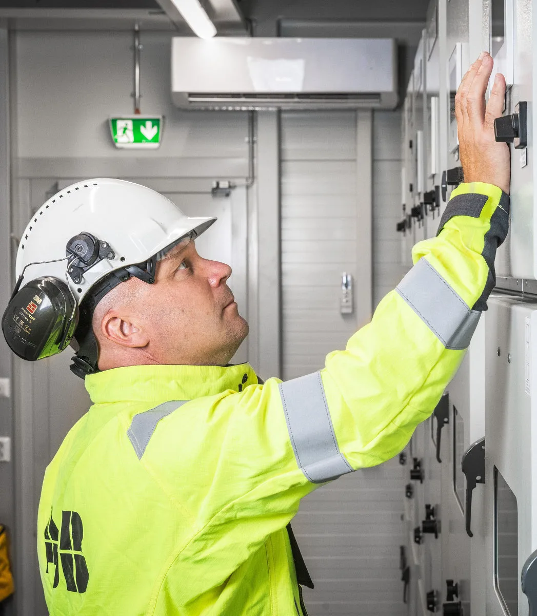 ABB REX615 with worker in plant