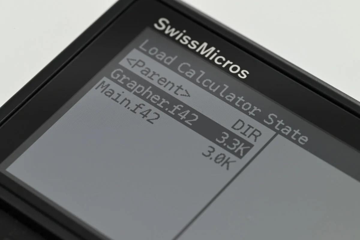 A close-up of the DM42n's display, showing the custom calculator state menu, with two options available: Grapher and Main.