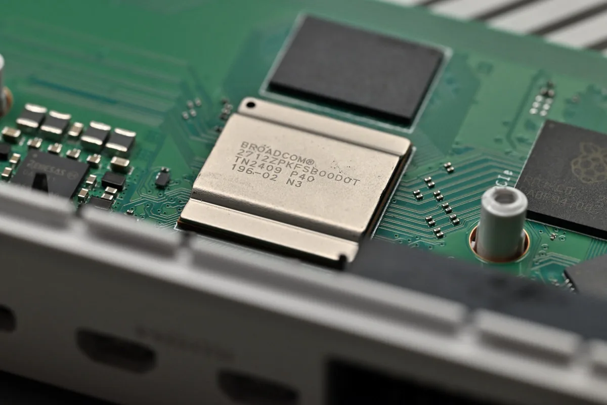 A photo showing a close-up shot of the BCM2712 processor and the 16 GB RAM module that sits above it.