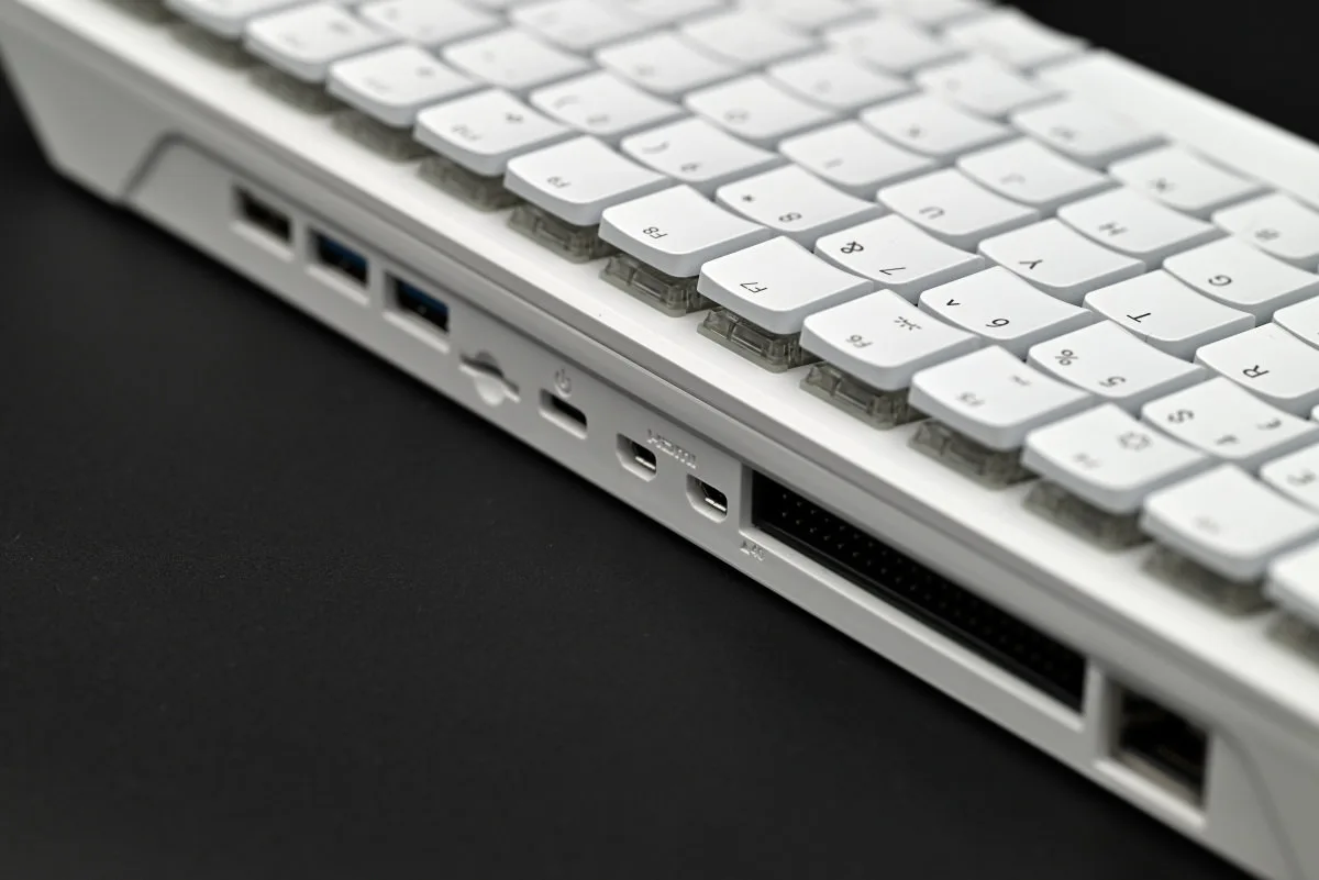 A photo showing a side profile of the keyboard's top row of switches and some of the computer's ports.