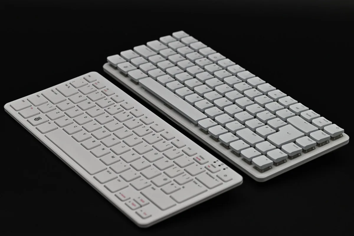 A photo showing the Raspberry Pi 500+ (right) and Raspberry PI 500 (left) side-by-side