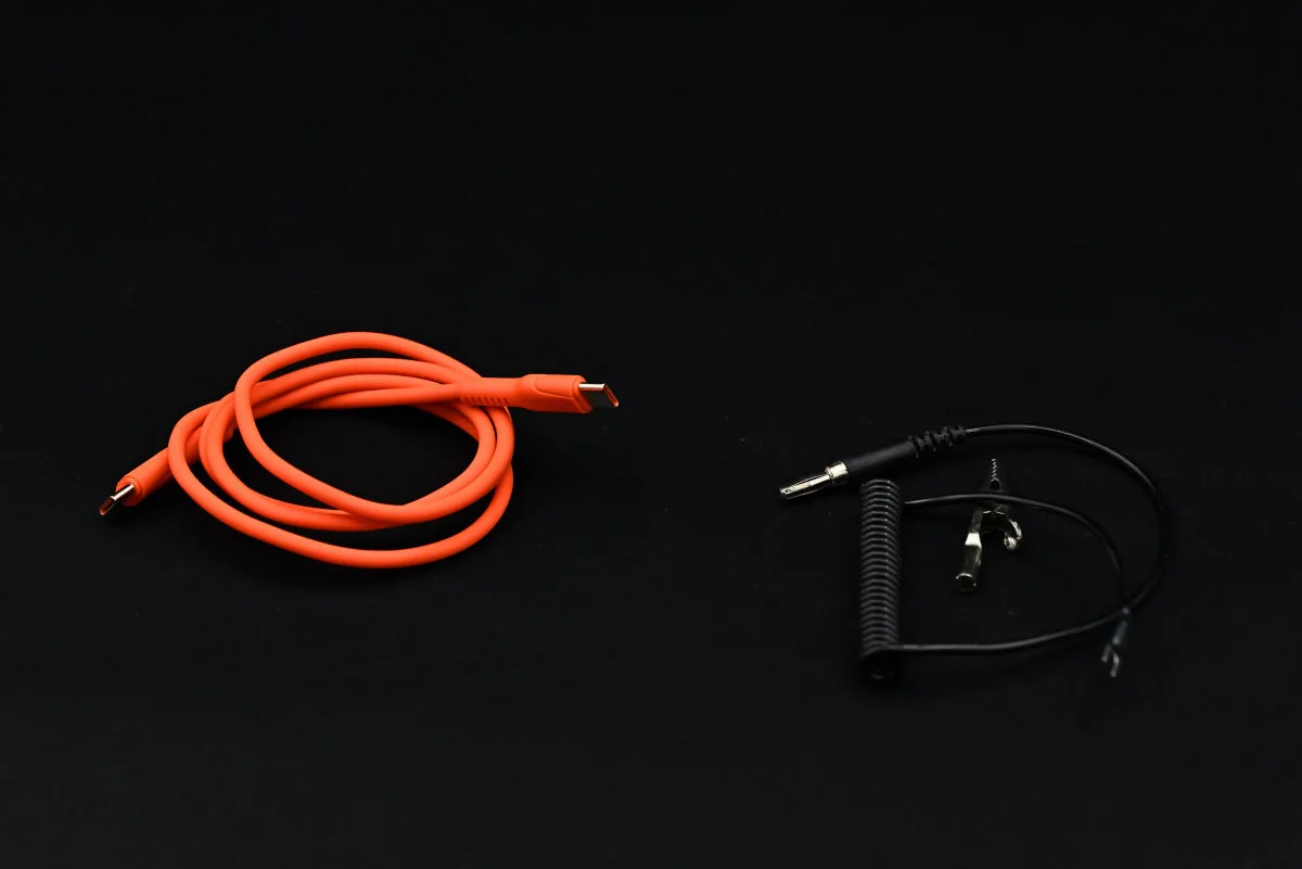 A photo of the included USB power cable (left) and sleep wire (right).
