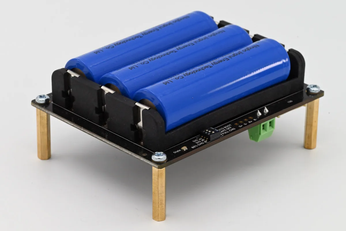 A photo of the UPS expansion board with three blue-colored Lithium-ion batteries slotted in.