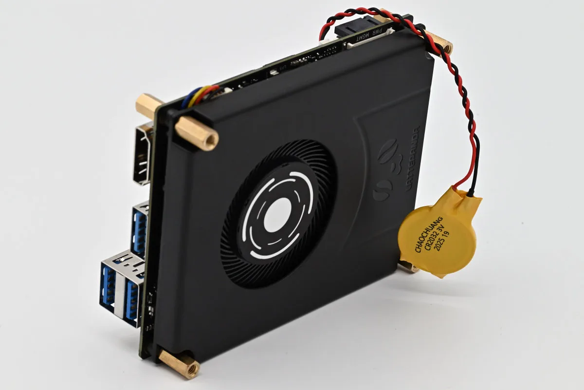 A photo showcasing the RTC battery dangling off to the side of the LattePanda IOTA.