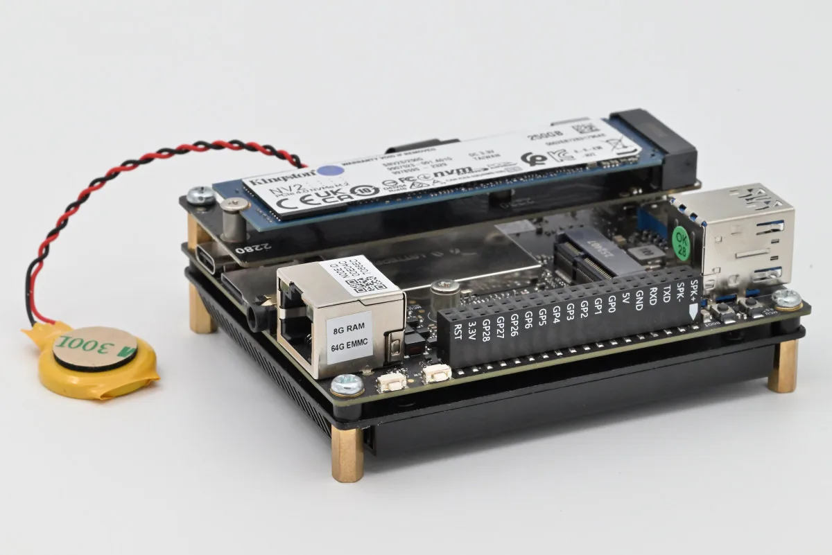 A photo of the IOTA assembled with its M.2 expansion board, and an SSD drive mounted.